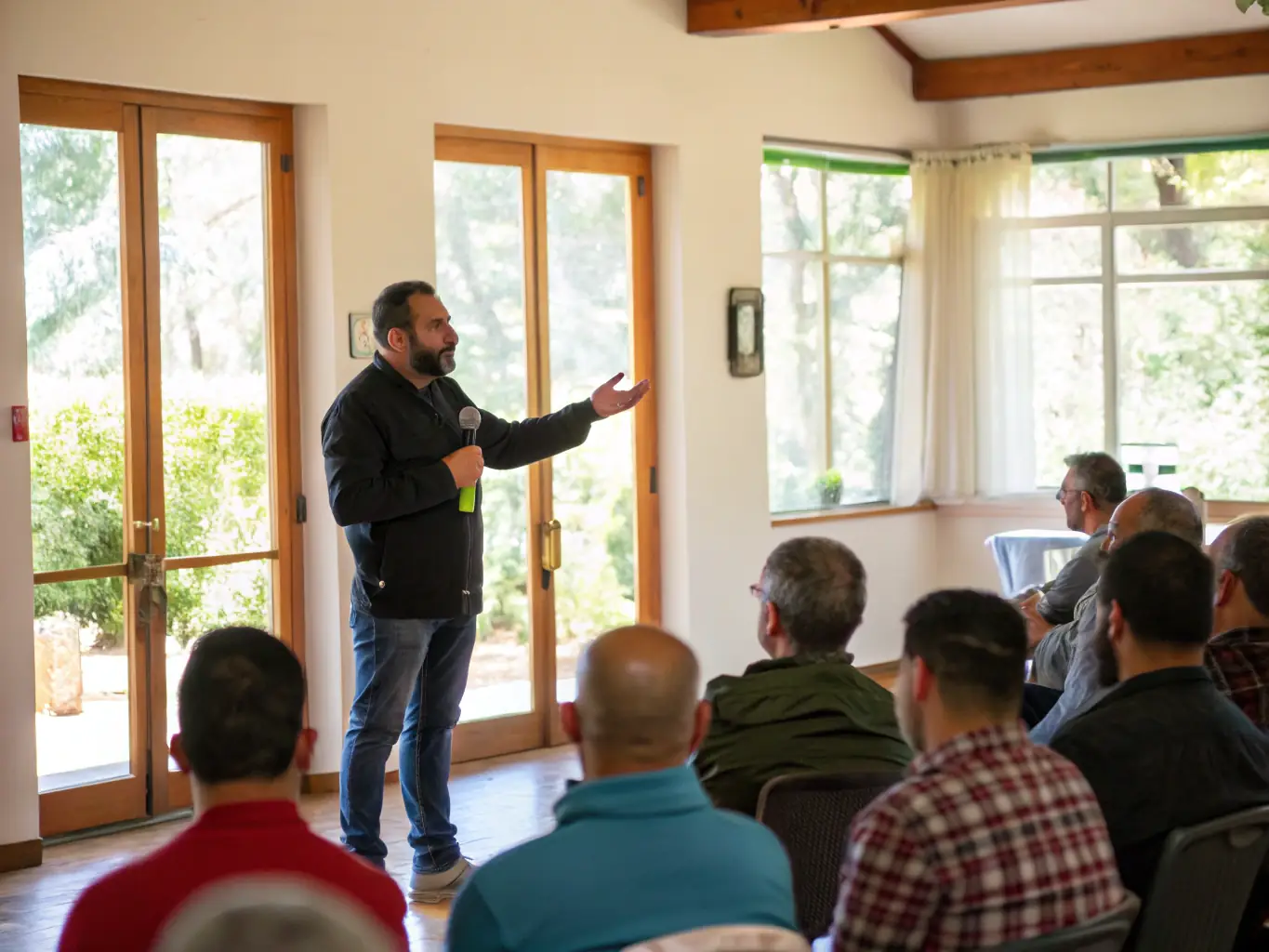 A photograph of Leo Marin leading a workshop session at Divorce Camp, providing guidance and support to participants, showcasing his expertise and dedication.